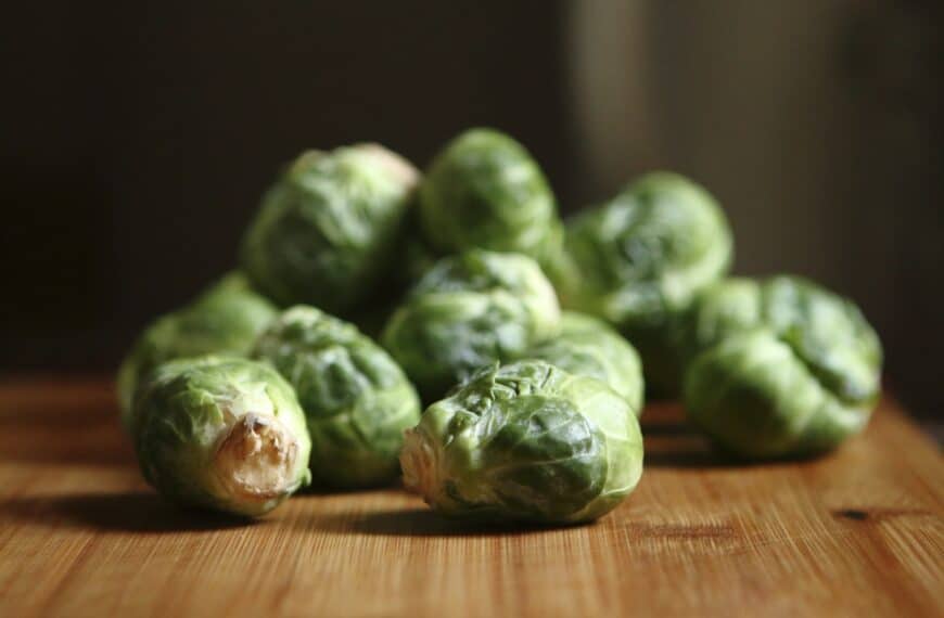 brussel sprouts on wooden cutting board