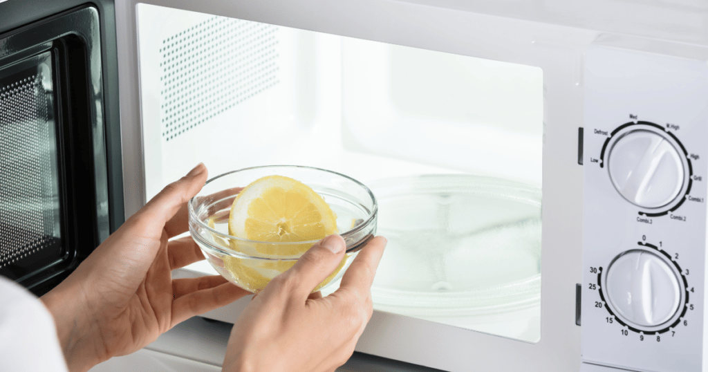white microwave clear glass bowl with water and lemon