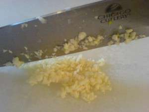 Hearty Potato Egg and Green Bean Salad - mincing garlic